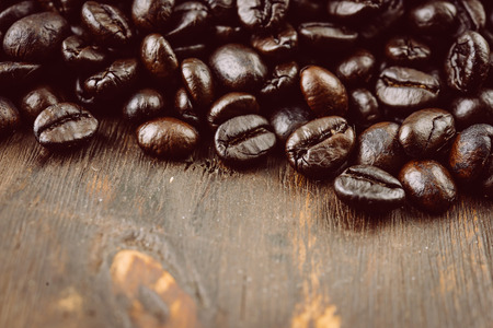 Coffee beans on wooden background - vintage effect style picturesの写真素材