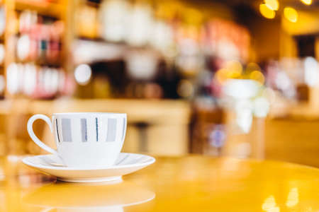 Coffee cup on wood table - vintage effect style picturesの写真素材