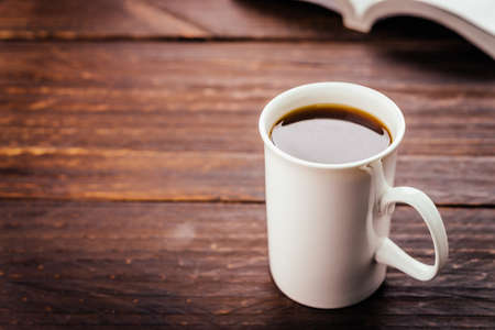 Coffee cup on wooden table - Vintage effect style picturesの写真素材