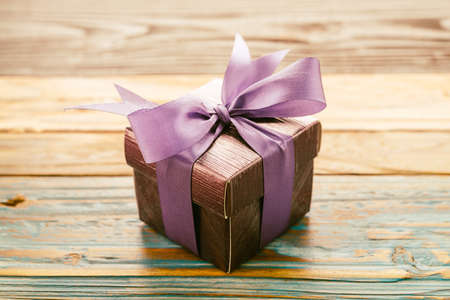 Gift box on wooden background - vintage effect style picturesの写真素材