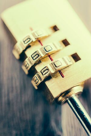 Close up pad lock on wooden background - vintage effect style picturesの写真素材
