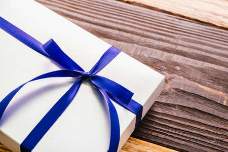 Gift box on wood background - vintage effect style picturesの写真素材