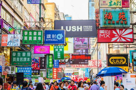 HONG KONG, CHINA - APR 10: Crowded street view on April 10, 2014 in Hong Kong, China. With 7M population and land mass of 1104 sq km, it is one of the most dense areas in the world.のeditorial素材