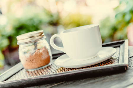 Coffee mug on wooden table - Vintage effect style picturesの写真素材