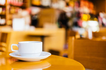 Coffee cup on wooden background - vintage effect picturesの写真素材