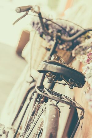 Vintage bicycle with flower - vintage effect filter style picturesの写真素材