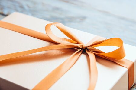 Gift box on wooden background - vintage effectの写真素材