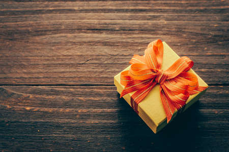 Gift box on wood background