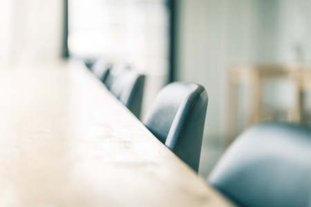 Selective soft focus point on chair in coffee shop - vintage effectの写真素材