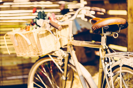 Vintage bicycle with flower - vintage effect filter style picturesの写真素材