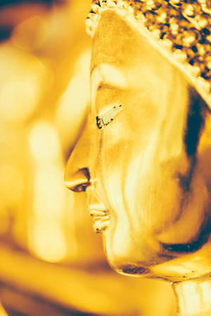 Selective focus point on Buddha statue in wat arun from thailand bangkok - vintage effect style picturesの写真素材