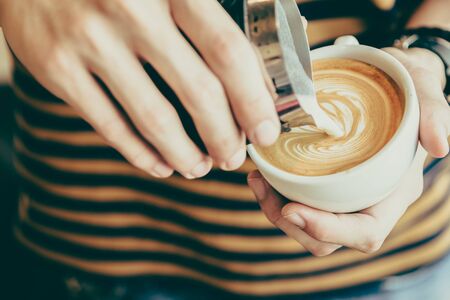 Latte art coffee cup - vintage effectの写真素材