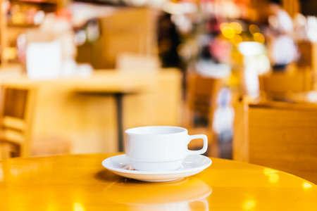 Coffee cup on wooden background - vintage effect pictures