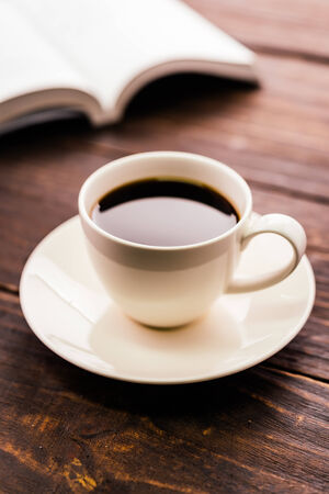 Coffee cup on wooden background - Vintage effect style picturesの写真素材
