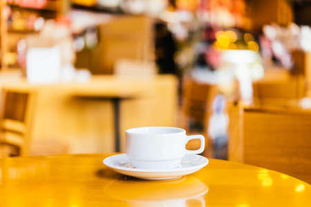 Coffee cup on wooden background - vintage effect picturesの写真素材