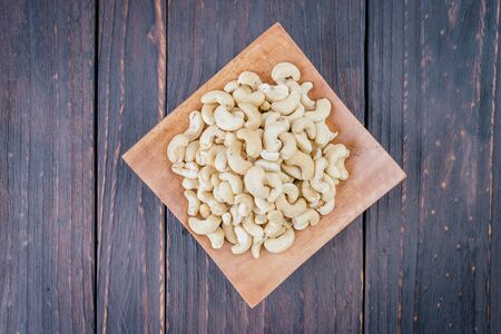 Cashew on wooden background - film effect style picturesの写真素材