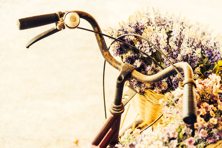 Vintage bicycle with flower - vintage effect filter style picturesの写真素材