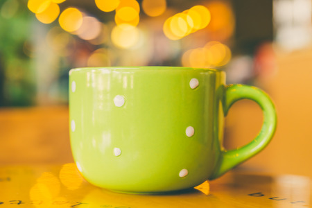 Coffee mug on wooden table - Vintage effect style picturesの写真素材