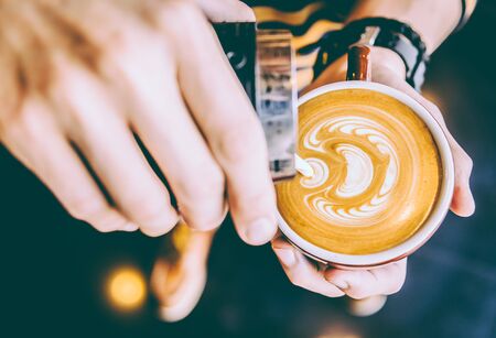 Latte art coffee cup - vintage effectの写真素材