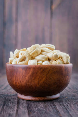 Cashew nuts on wooden backgroundの写真素材