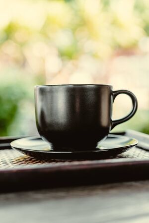 Coffee mug on wooden table - Vintage effect style picturesの写真素材