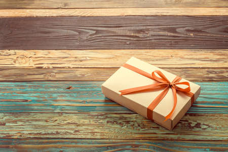 Gift box on wooden background - vintage effect style picturesの写真素材