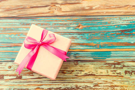 Gift box on wooden background - vintage effect style picturesの写真素材