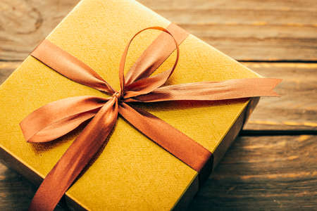Gift box on wood background - vintage effect style picturesの写真素材