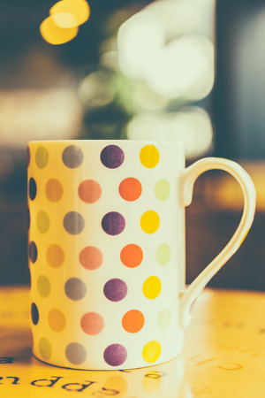 Coffee cup on wooden table in coffee shop cafe - Vintage effect style pictureの写真素材