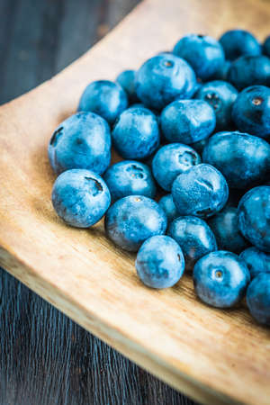 Blueberry bowl on wooden background - vintage effect style picturesの写真素材