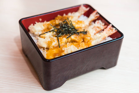 Tempura rice - rice with fried shrimp on top - japanese food - selective focusの写真素材