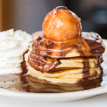 Chocolate pancakes with ice cream on top - soft focus pointの写真素材