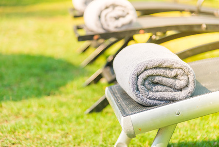 Towel on bed pool with sun flare filter