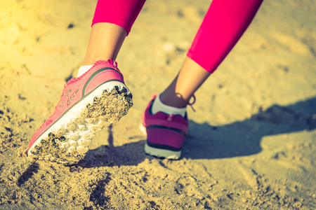 Selective Running shoes on the beach - vintage effect and sun flare filter processの写真素材