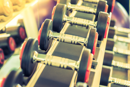 Dumbbell selective focus point - vintage filter and sun flare effectの写真素材