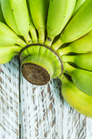 Close up Green Banana on wooden backgroundの写真素材