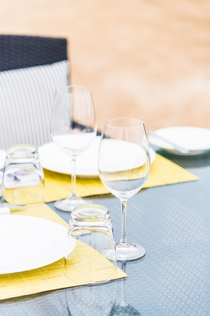 Wine glass on table in restaurantの写真素材