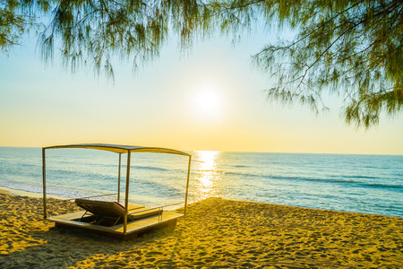 Beach bed with sun flare twilight time