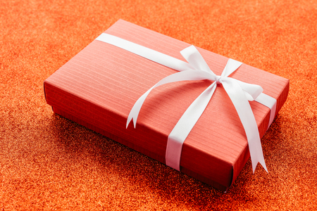 Gift box on red backgroundの写真素材