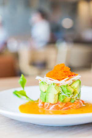 Tartar salmon with avocado salad - japanese food styleの写真素材