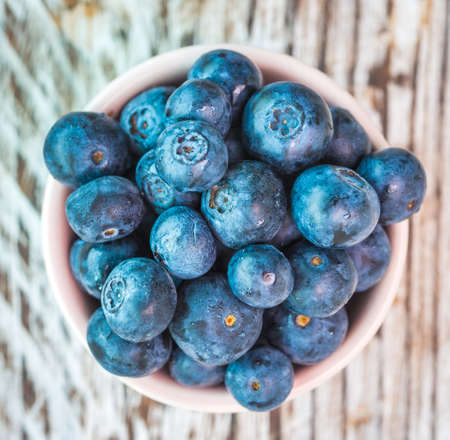Blueberry cup on wooden backgroundの写真素材