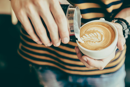 Latte art coffee cup - vintage effectの写真素材