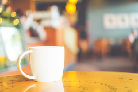 Coffee cup in coffee shop - vintage effect style pictureの写真素材