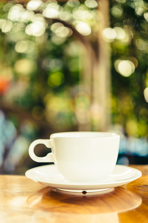 Coffee cup on wooden table outdoor backgroundの写真素材