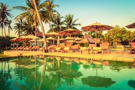 Bed pool deck with sunrise on twilight time - vintage filter effectの写真素材