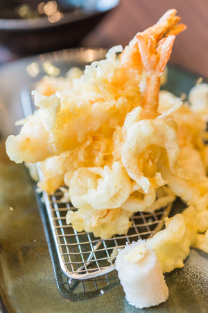 Tempur prawn - fried shrimp japanese style in black plate on wooden tablesの写真素材