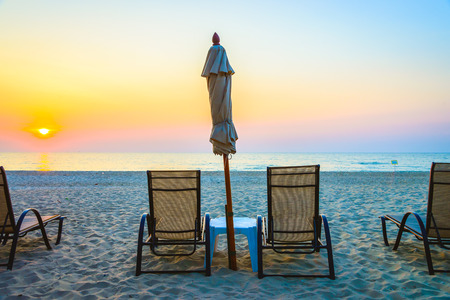 Beach chair with sunrise on twilight time - vintage filterの写真素材
