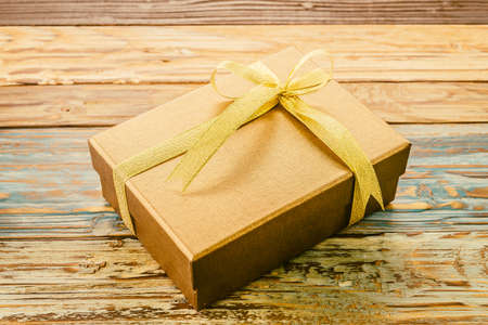 Gift box on wooden background - vintage effectの写真素材