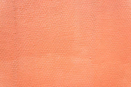 Orange concrete wall textures backgroundの写真素材