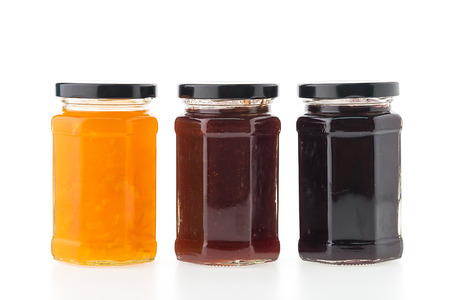 Jam jar bottles isolated on white backgroundの写真素材